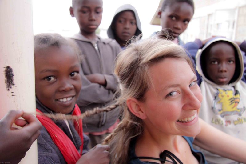 East African Mission Orphanage - Meggan getting her hair braided