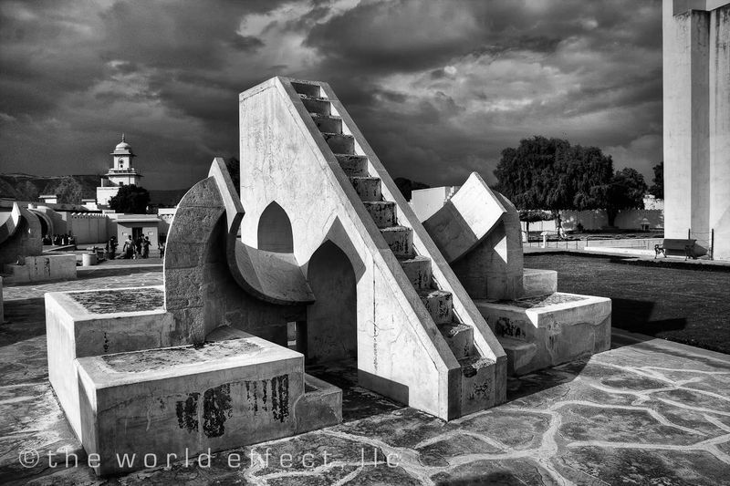 Small sundial with city palace in the background. Jaipur, India