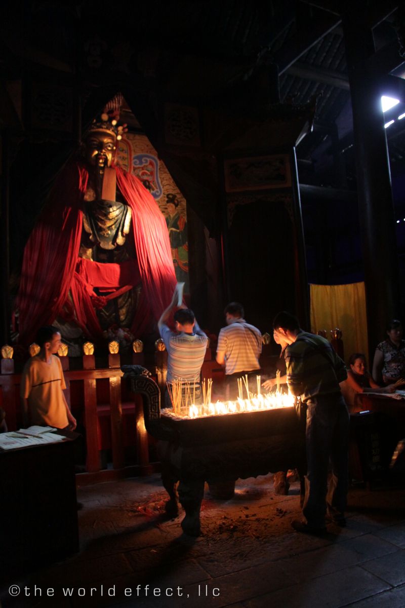 Worshipers at a Buddhist temple on the Yangtzee river. Worshipers at a Buddhist temple on the Yangtzee river.