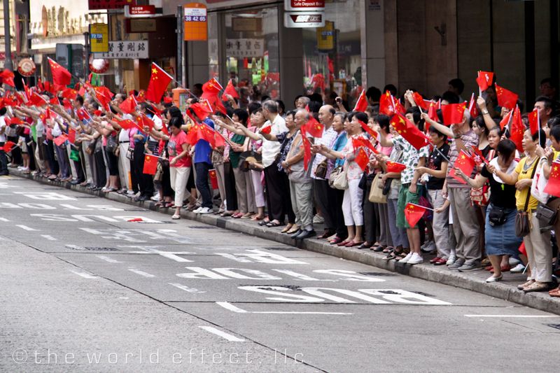 Hong Kong Parade watchers waving China flags. Hong Kong Hong Kong Parade watchers waving China flags. Hong Kong